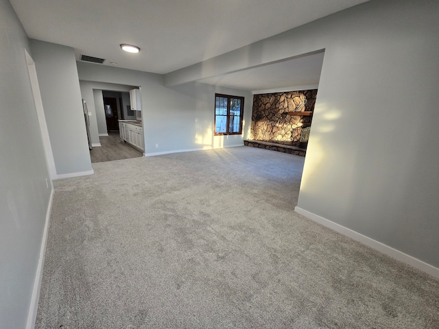 unfurnished living room with carpet flooring