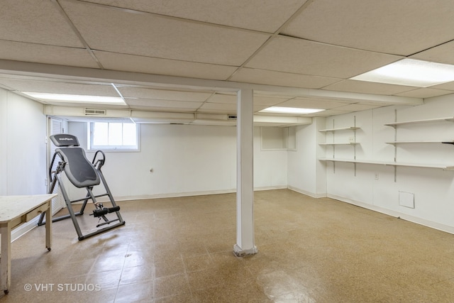 basement featuring a paneled ceiling