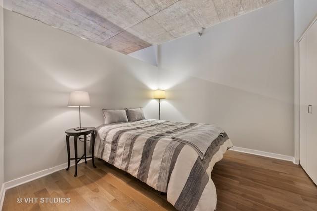 bedroom with hardwood / wood-style floors