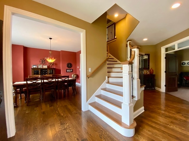 stairs with hardwood / wood-style flooring