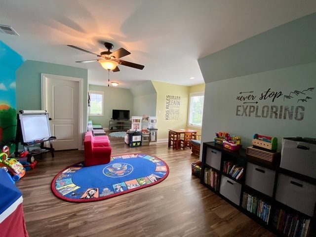 rec room featuring hardwood / wood-style floors and ceiling fan