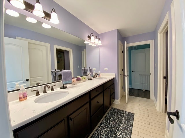 bathroom featuring vanity and hardwood / wood-style flooring