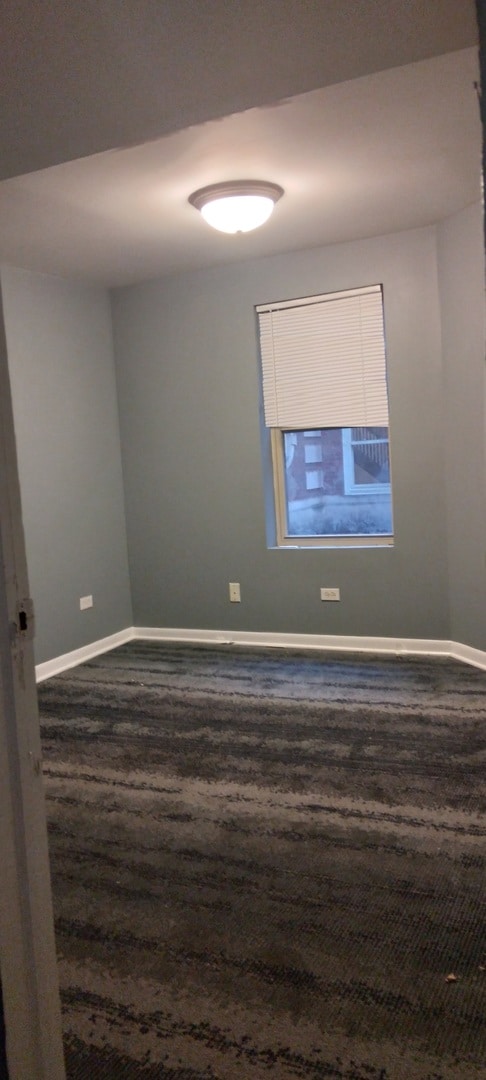 unfurnished room featuring dark hardwood / wood-style floors