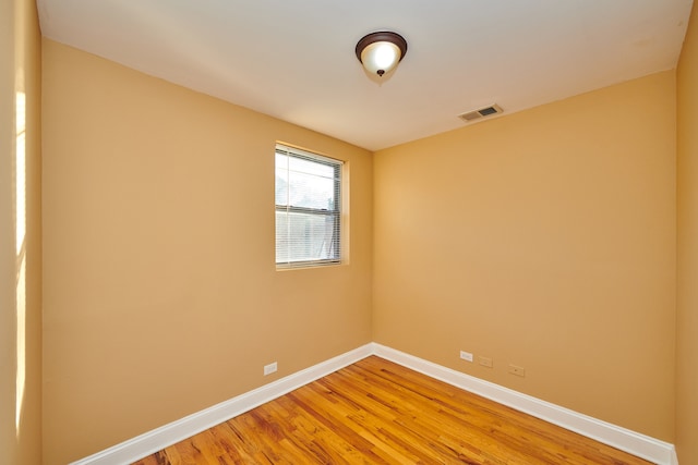 empty room featuring wood-type flooring