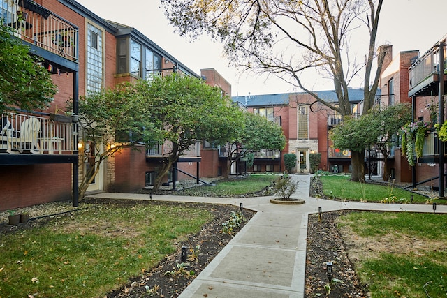 view of home's community with a lawn