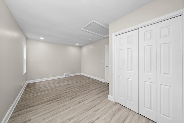 basement featuring light hardwood / wood-style flooring