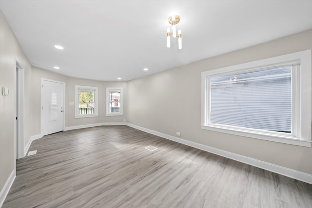 unfurnished room featuring light wood-type flooring