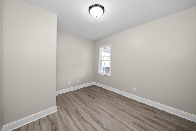 unfurnished room with light hardwood / wood-style flooring