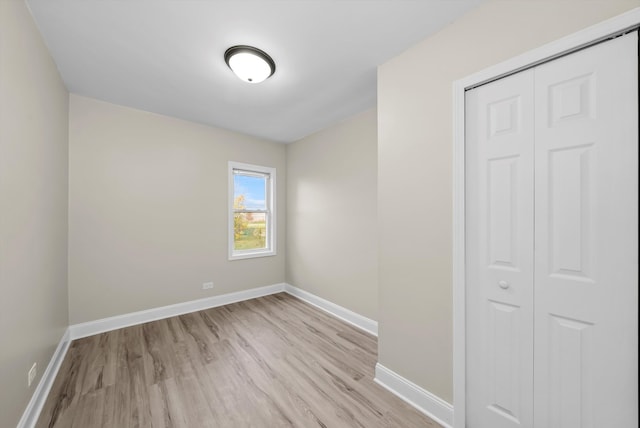 empty room with light hardwood / wood-style floors