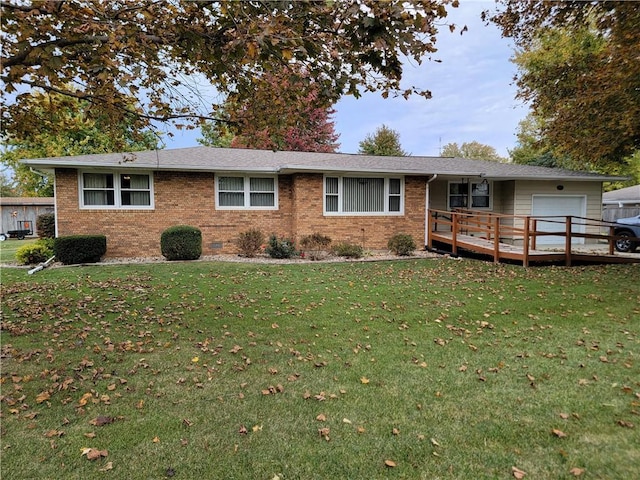 view of front of property featuring a wooden deck, a garage, and a front lawn