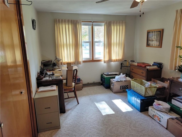 carpeted home office featuring ceiling fan