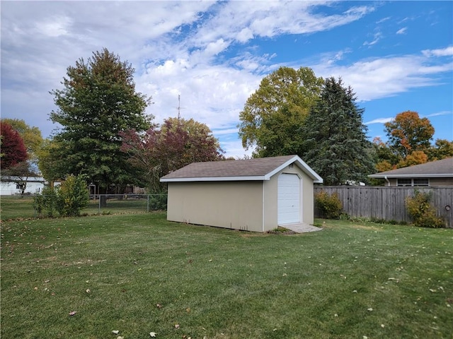 view of outbuilding with a lawn