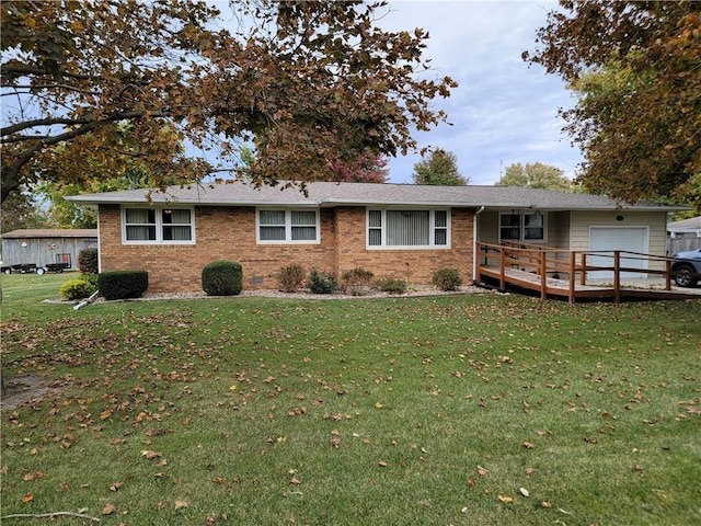 ranch-style home with a wooden deck and a front lawn