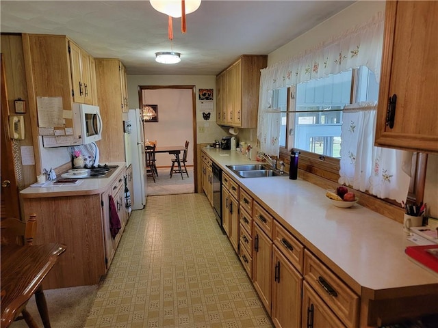 kitchen featuring white appliances and sink