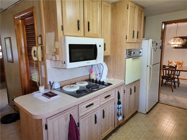 kitchen featuring white appliances, a chandelier, light brown cabinets, and hanging light fixtures