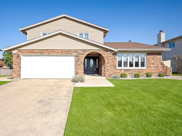 view of front of house featuring a front lawn and a garage