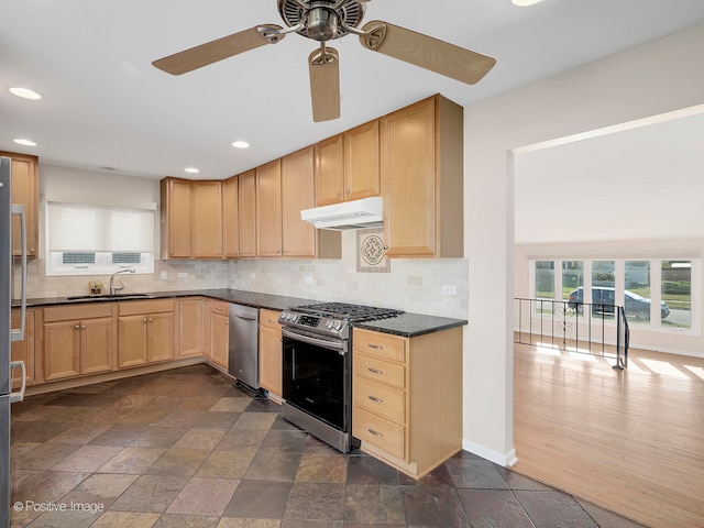 kitchen featuring light brown cabinetry, sink, dark hardwood / wood-style flooring, stainless steel appliances, and decorative backsplash