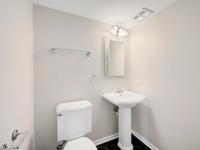 bathroom featuring tile patterned floors, sink, and toilet