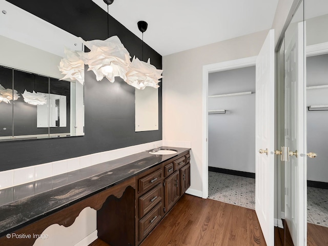 bathroom with vanity and wood-type flooring