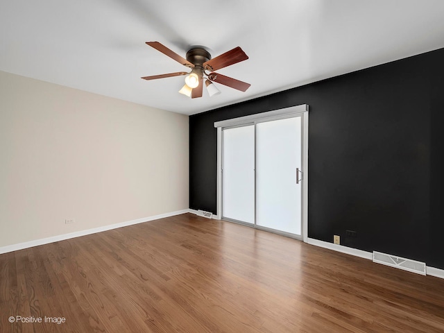 unfurnished bedroom with hardwood / wood-style flooring and ceiling fan