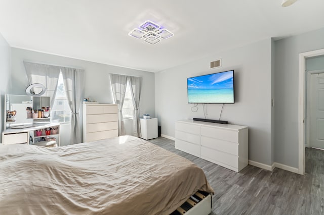 bedroom with hardwood / wood-style flooring