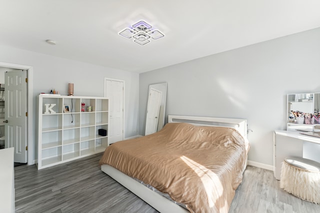 bedroom featuring wood-type flooring