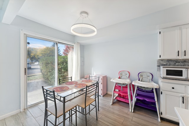 dining room with light hardwood / wood-style flooring