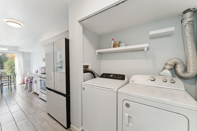 laundry room featuring washer and clothes dryer