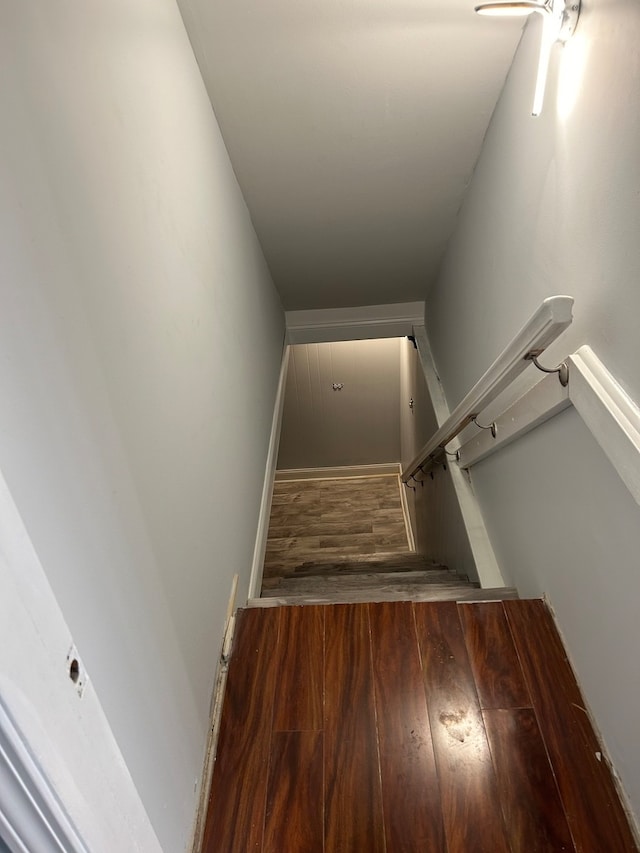 stairway featuring hardwood / wood-style flooring