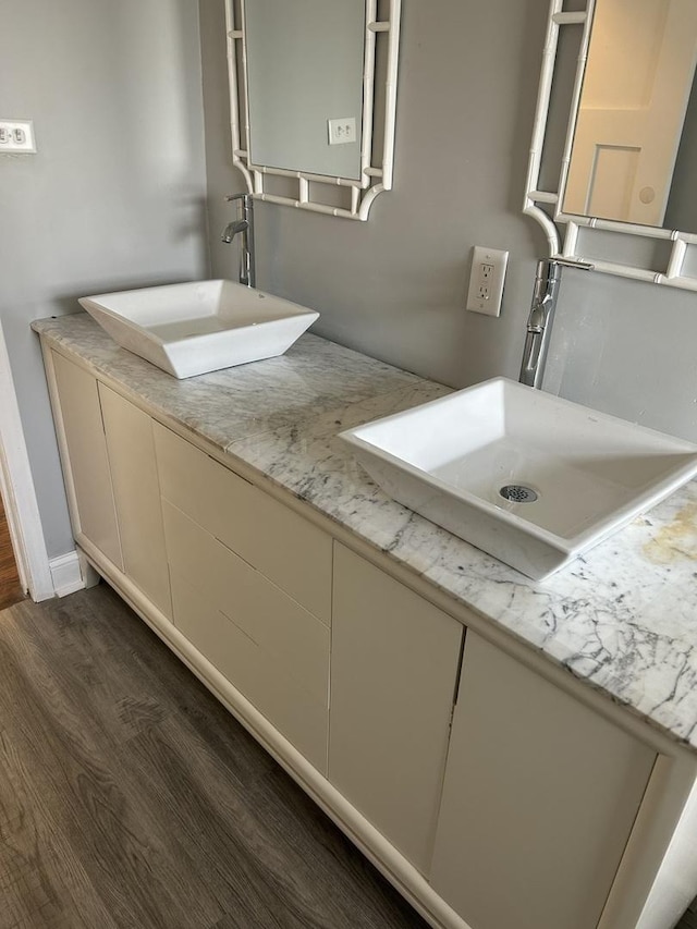 bathroom featuring hardwood / wood-style flooring and sink