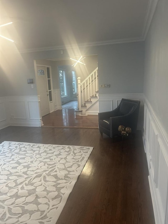 interior space featuring hardwood / wood-style flooring and ornamental molding