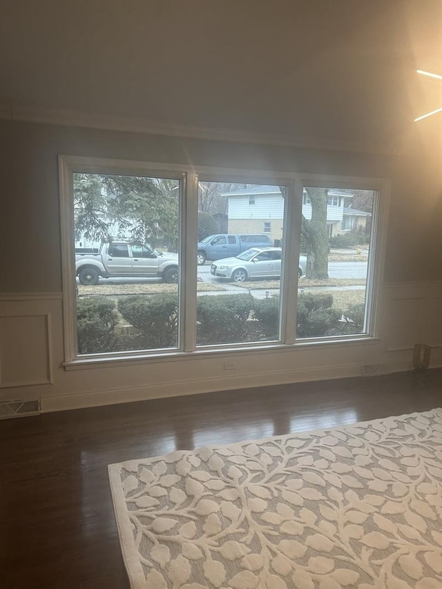 additional living space with hardwood / wood-style flooring