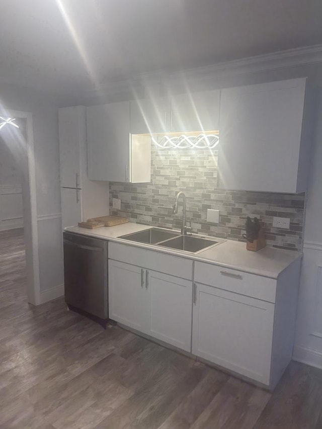 kitchen featuring white cabinetry, sink, dark hardwood / wood-style floors, and dishwasher