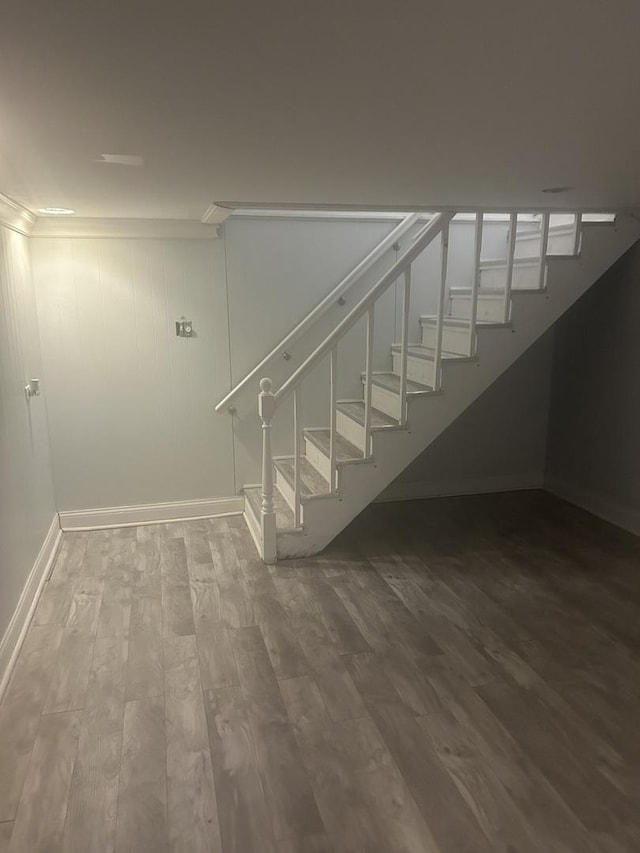 stairs with hardwood / wood-style flooring