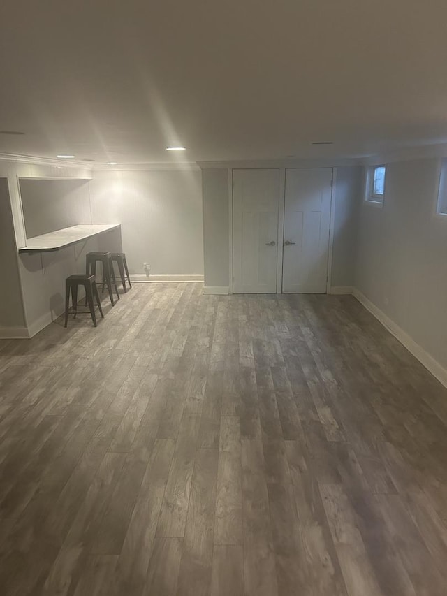 additional living space featuring dark hardwood / wood-style flooring