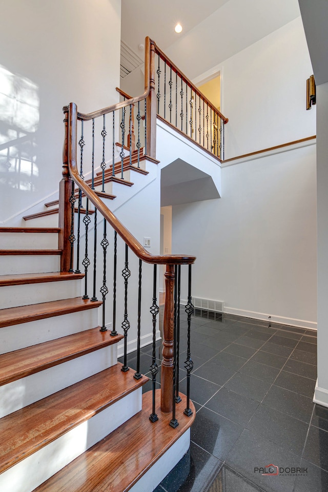 stairway with a high ceiling