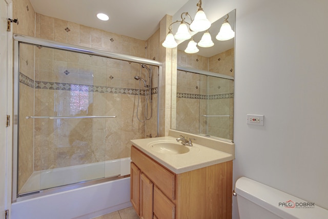 full bathroom with toilet, enclosed tub / shower combo, vanity, and tile patterned flooring