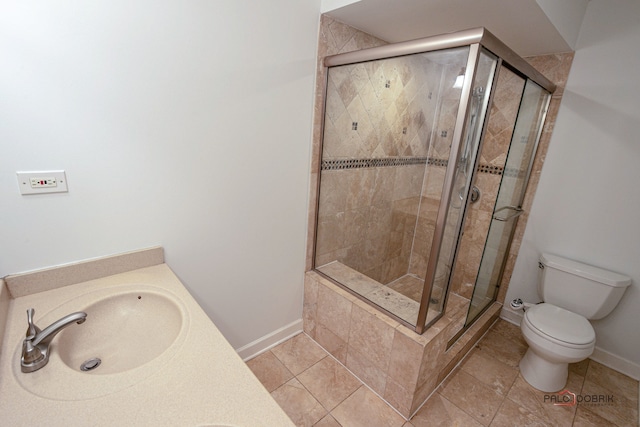 bathroom with sink, tile patterned flooring, toilet, and walk in shower