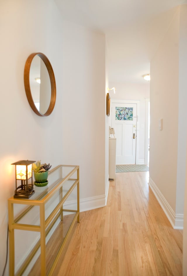 hall with light hardwood / wood-style flooring