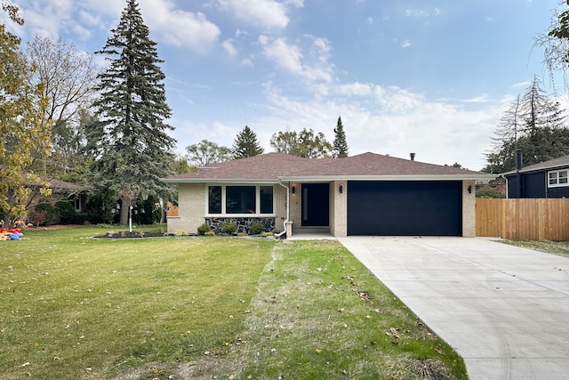 ranch-style house with a garage and a front lawn