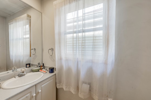 bathroom featuring vanity and plenty of natural light