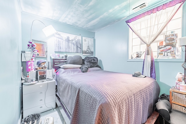 bedroom with ornamental molding and carpet floors