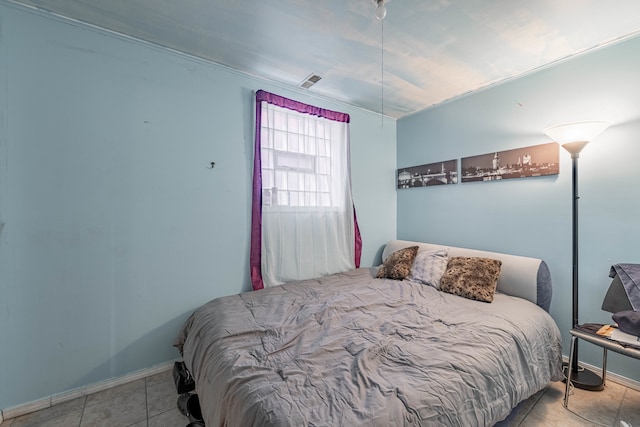 bedroom featuring light tile patterned floors