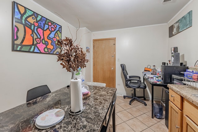 tiled dining room featuring ornamental molding