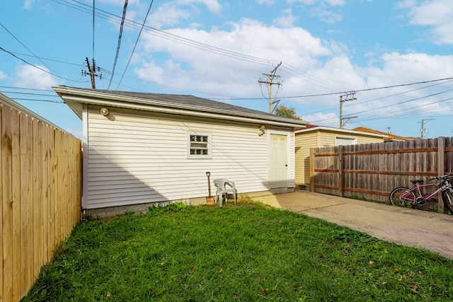 view of side of home with a yard