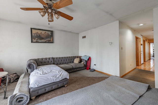 living room featuring light carpet and ceiling fan