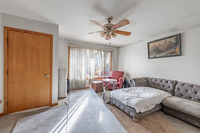 carpeted living room featuring ceiling fan