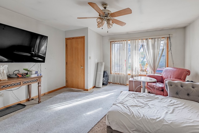 carpeted bedroom with a closet and ceiling fan