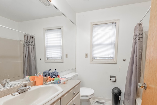 full bathroom featuring vanity, shower / bath combo, toilet, and tile patterned flooring