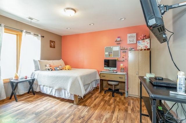 bedroom featuring wood-type flooring